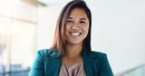 Happy confident portrait of businesswoman in lobby
